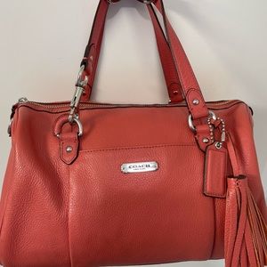 Coral/Salmon colored Coach handbag; gently used and in very good condition.